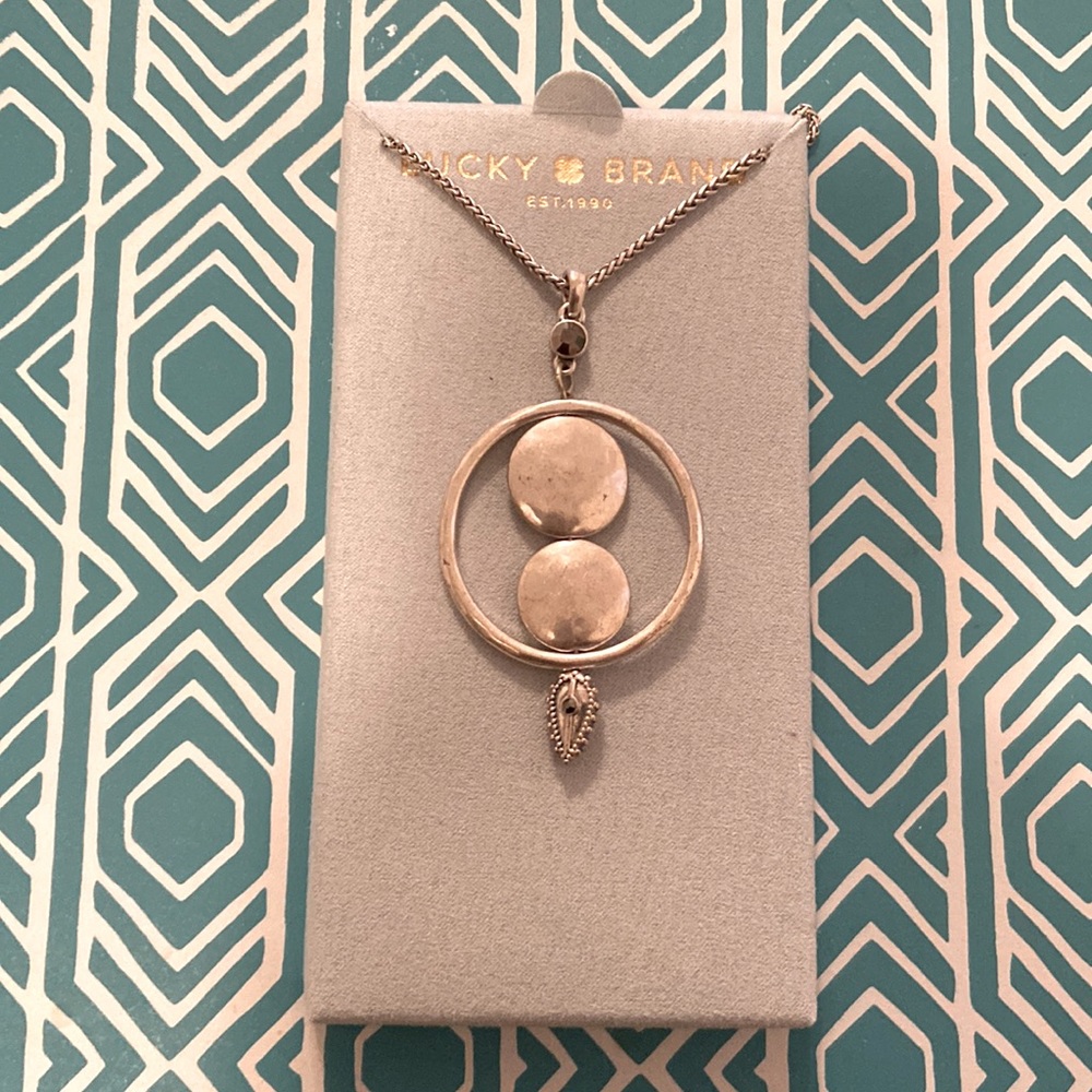 Lucky Brand silver with two smoke colored stones.